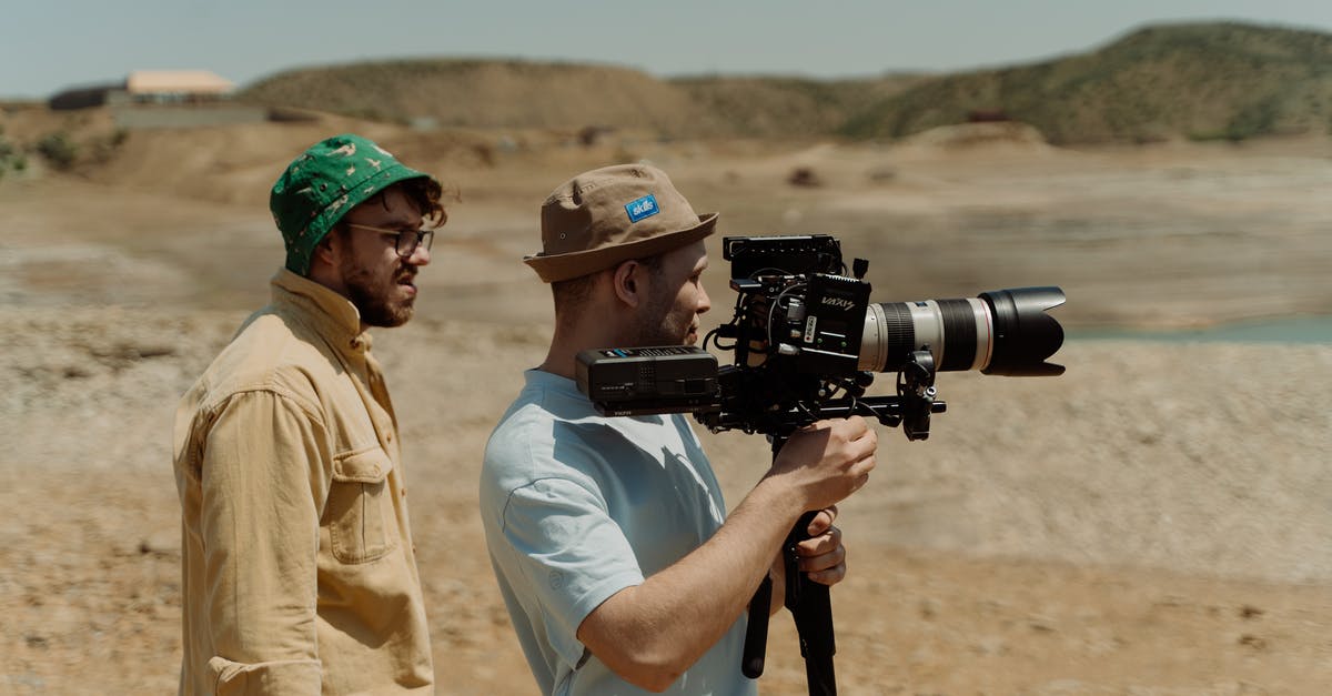 Is it possible to set a default hat? - A Man in Brown Bucket Hat Holding a Video Camera while Standing Beside the Man in Green Bucket Hat Is it possible to set a default hat? - A Man in Brown Bucket Hat Holding a Video Camera while Standing Beside the Man in Green Bucket Hat