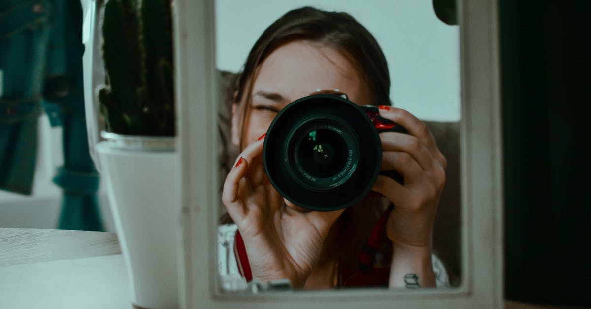 Is it possible to shoot through squad shields? - Woman taking photo through small mirror