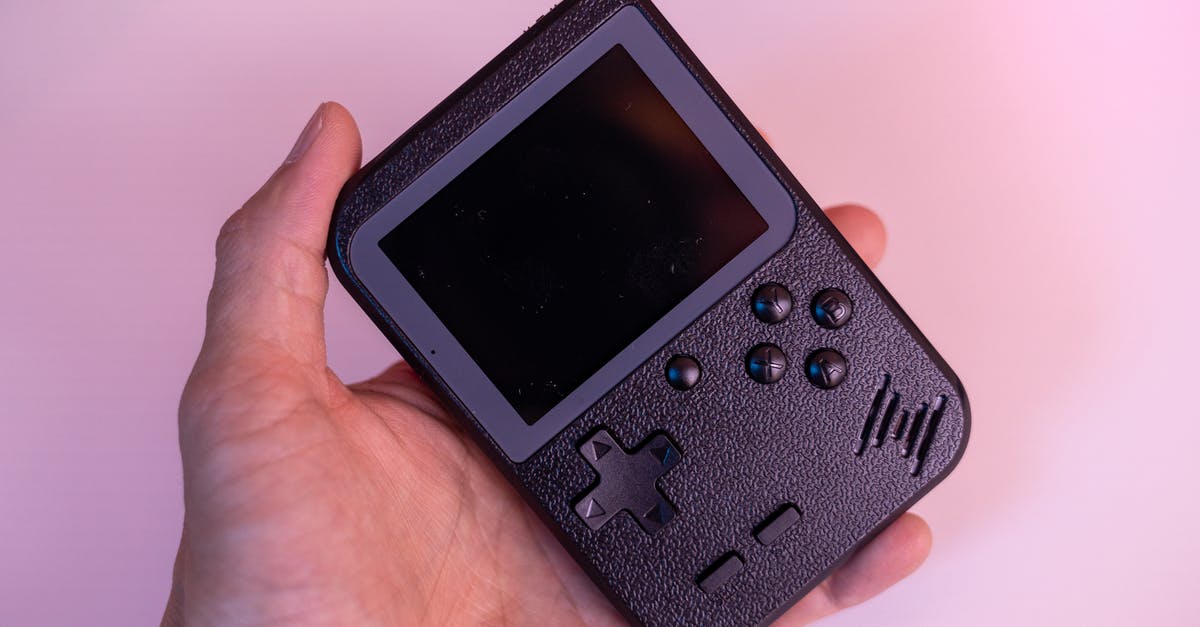 Is it possible to trade from an emulator into a nintendo device? - A Hand Holding a Game Boy 