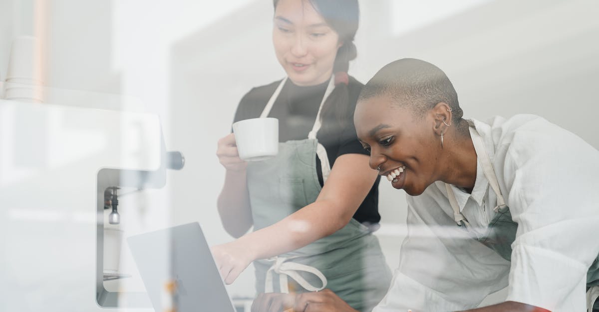 Is it possible to unlock new guns without using Multiplayer? - Through glass of friendly young Asian head barista showing young cheerful African American female coworker how to use special program on laptop Is it possible to unlock new guns without using Multiplayer? - Through glass of friendly young Asian head barista showing young cheerful African American female coworker how to use special program on laptop