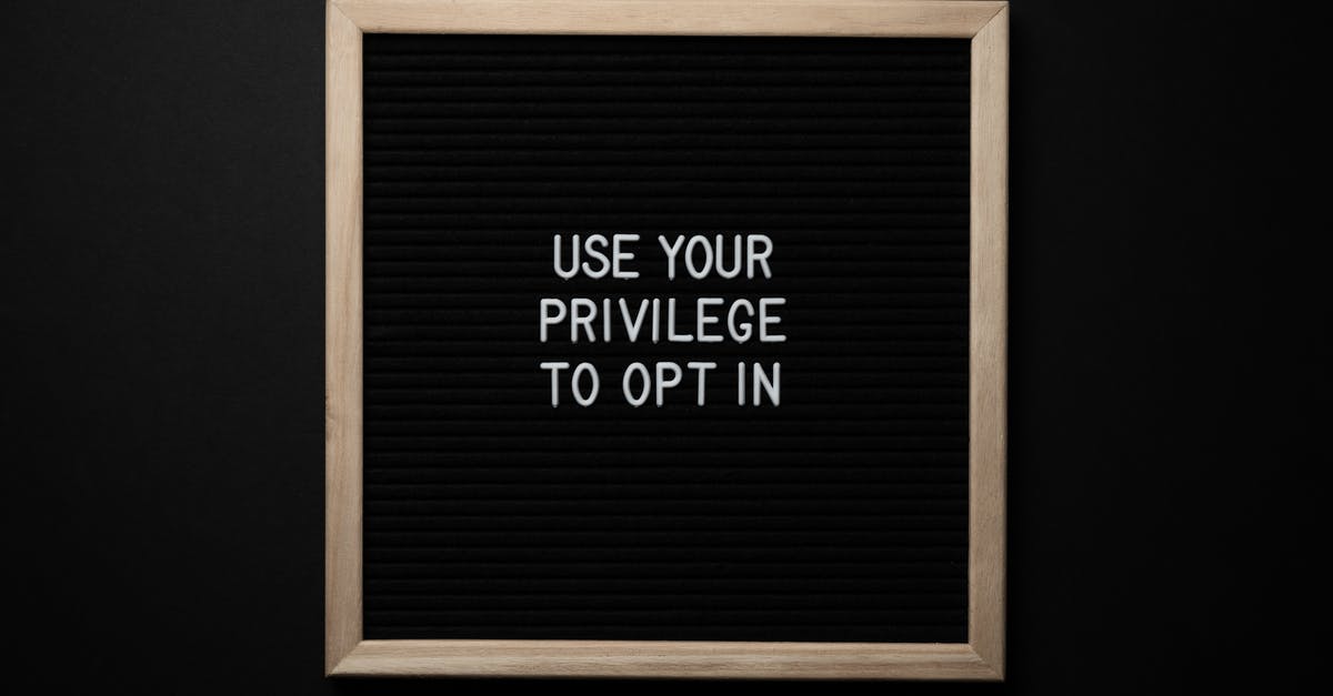 Is it possible to use a button to change the text - From above composition of contrast blackboard in wooden frame with white USE YOUR PRIVILEGE TO OPT IN title on black background