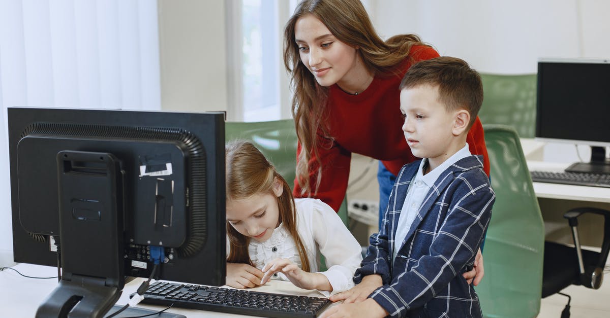 Is it possible to use multiple keyboards? - Teacher with Children Using Computer Is it possible to use multiple keyboards? - Teacher with Children Using Computer