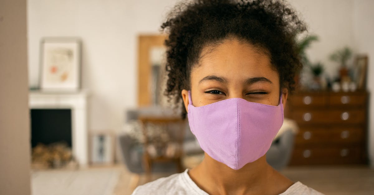 Is it safe to abandon a child when moving in with your husband? - Cheerful African American teenage girl wearing protective mask winking and looking at camera on blurred background during coronavirus pandemic at home Is it safe to abandon a child when moving in with your husband? - Cheerful African American teenage girl wearing protective mask winking and looking at camera on blurred background during coronavirus pandemic at home