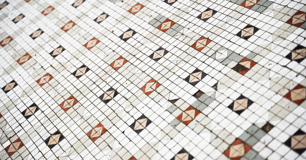 Is it safe to modify the figure part of an amiibo? - From above of geometric pattern of symmetrical ceramic tile on wall in daylight