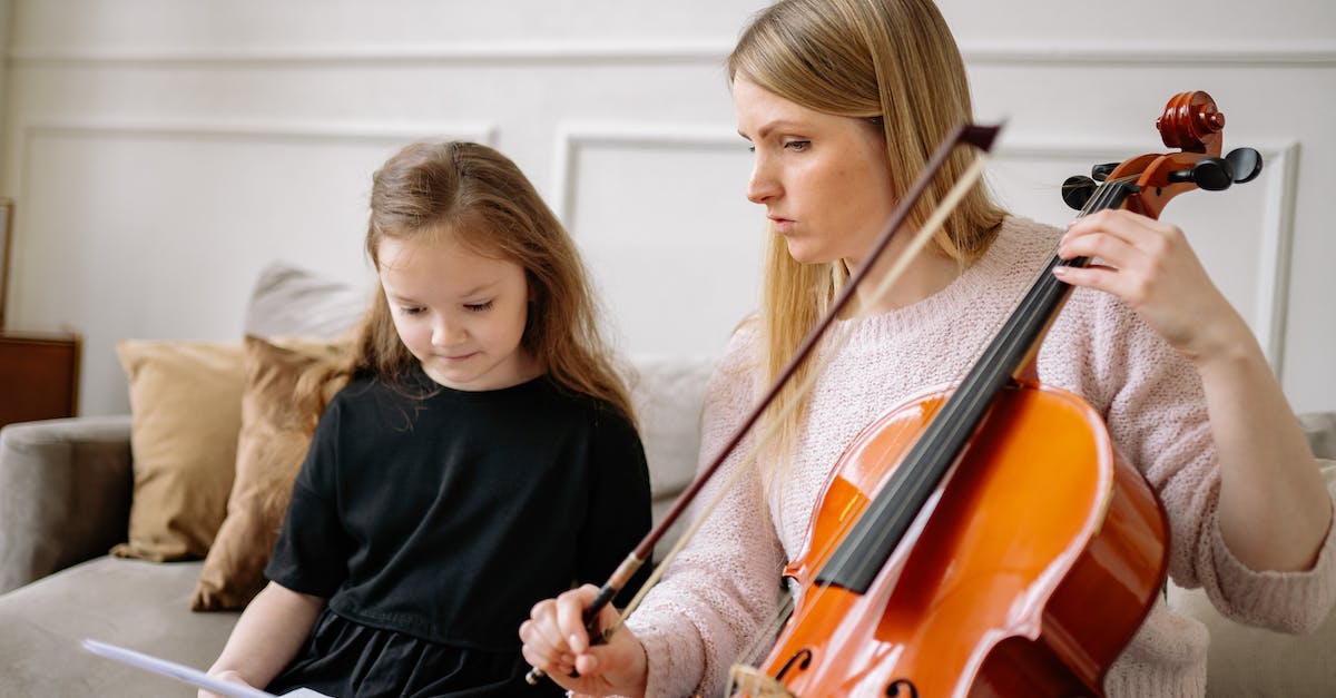 Is it true that the cupid bow is "lucky" - Woman in Black Long Sleeve Shirt Playing Violin