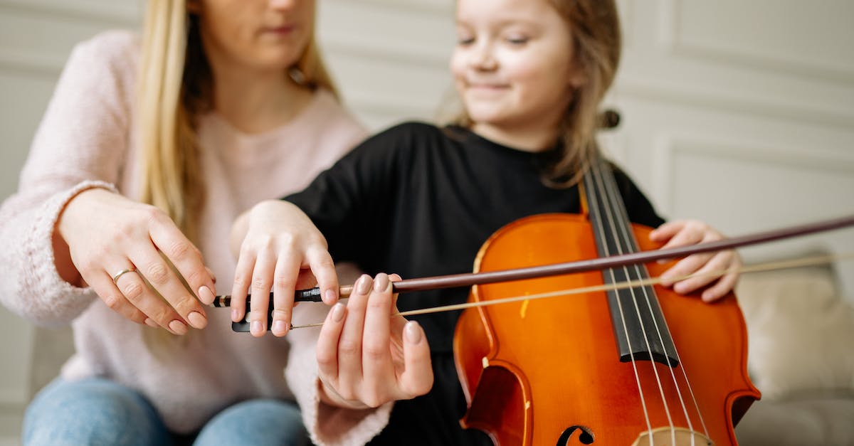 Is it true that the cupid bow is "lucky" - Woman in Black Long Sleeve Shirt Playing Violin
