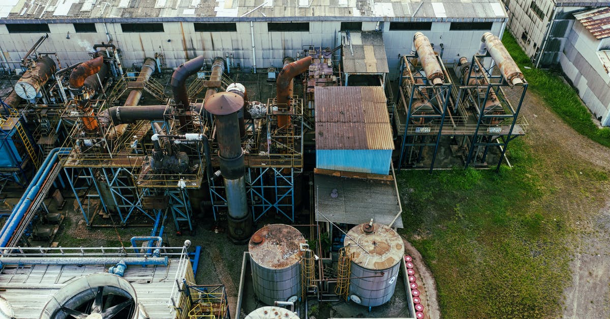Is it viable to tank with heavy armor without the Quen shield? - Drone view of industrial area with barrels for petroleum products and pipes connected with warehouses