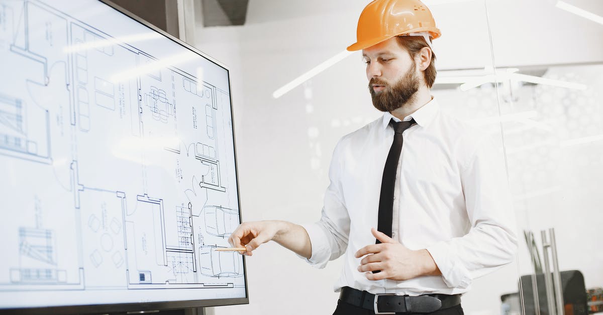 Is it yet possible to blueprint Concrete? - Man in White Dress Shirt and Orange Hard Hat Holding White Printer Paper Is it yet possible to blueprint Concrete? - Man in White Dress Shirt and Orange Hard Hat Holding White Printer Paper