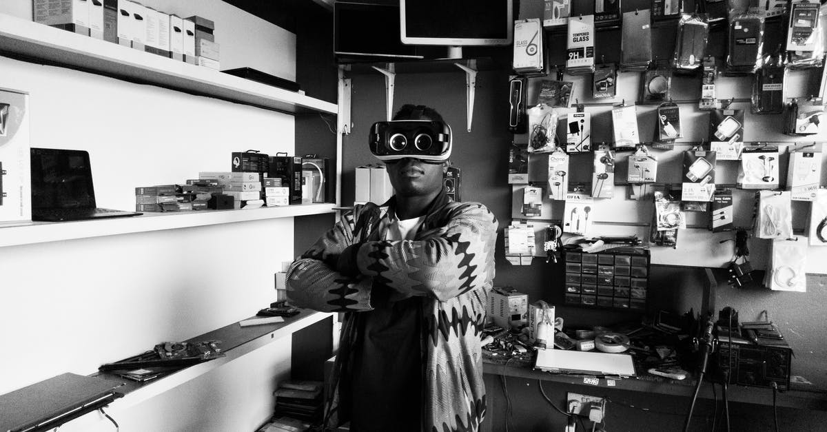 Is Minecraft VR cross play with other platforms? - Black man in VR goggles in electronics store Is Minecraft VR cross play with other platforms? - Black man in VR goggles in electronics store