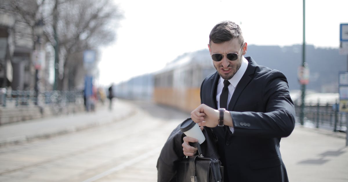 Is my job successful if I die after the objectives are complete? - Man in Black Suit Jacket Holding Black Leather Bag