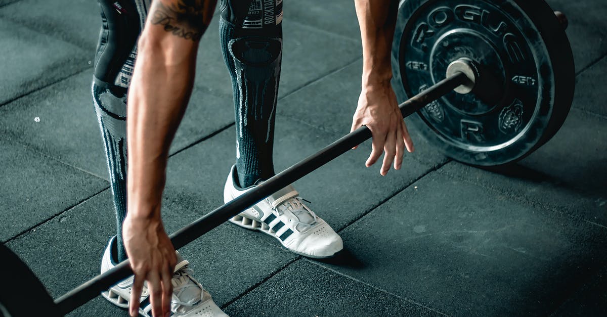 Is Orc or Imperial better for a one-handed heavy armor warrior? - Man Using Barbell