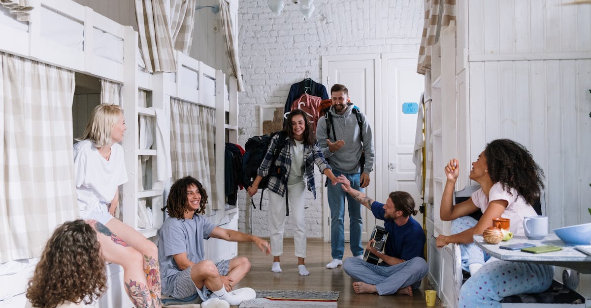 Is parry available in PvE? - Group of People Sitting on Brown Wooden Floor