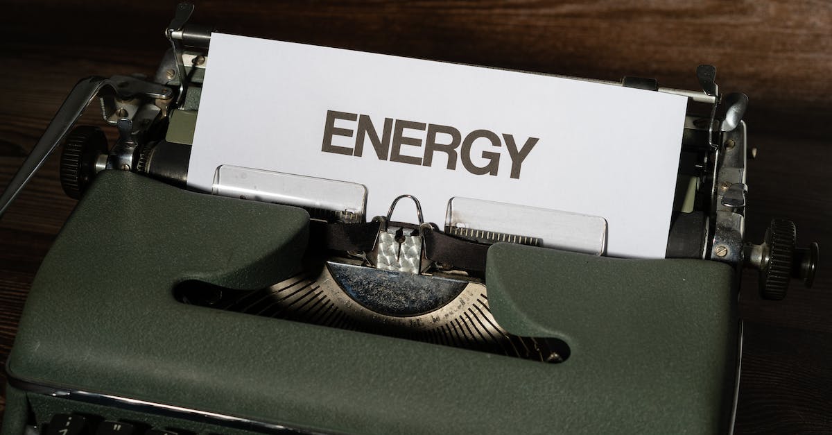 Is picking up energy instant? - Green and White Typewriter on Brown Wooden Table