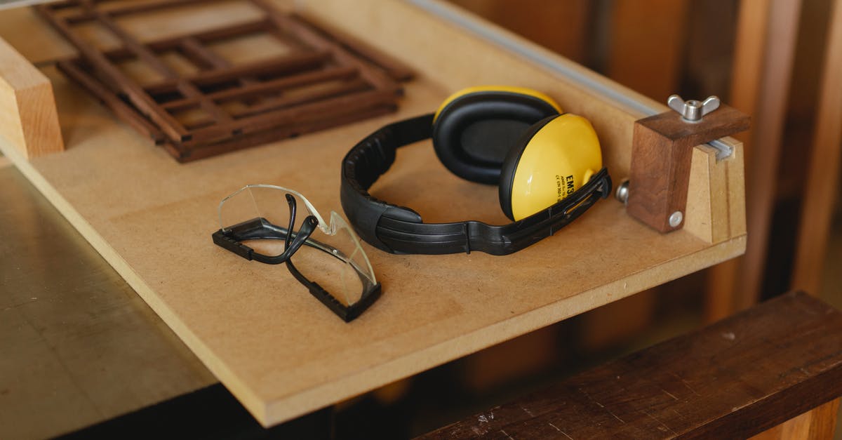 Is reload cancelling faster? - From above of noise cancelling headphones with protective glasses for joinery on wooden table in workroom Is reload cancelling faster? - From above of noise cancelling headphones with protective glasses for joinery on wooden table in workroom