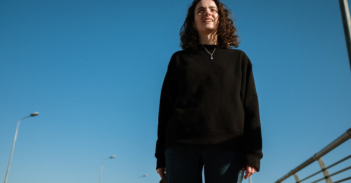 Is running possible in Dead Space 3? - Woman in Black Hoodie Standing Near White Fence