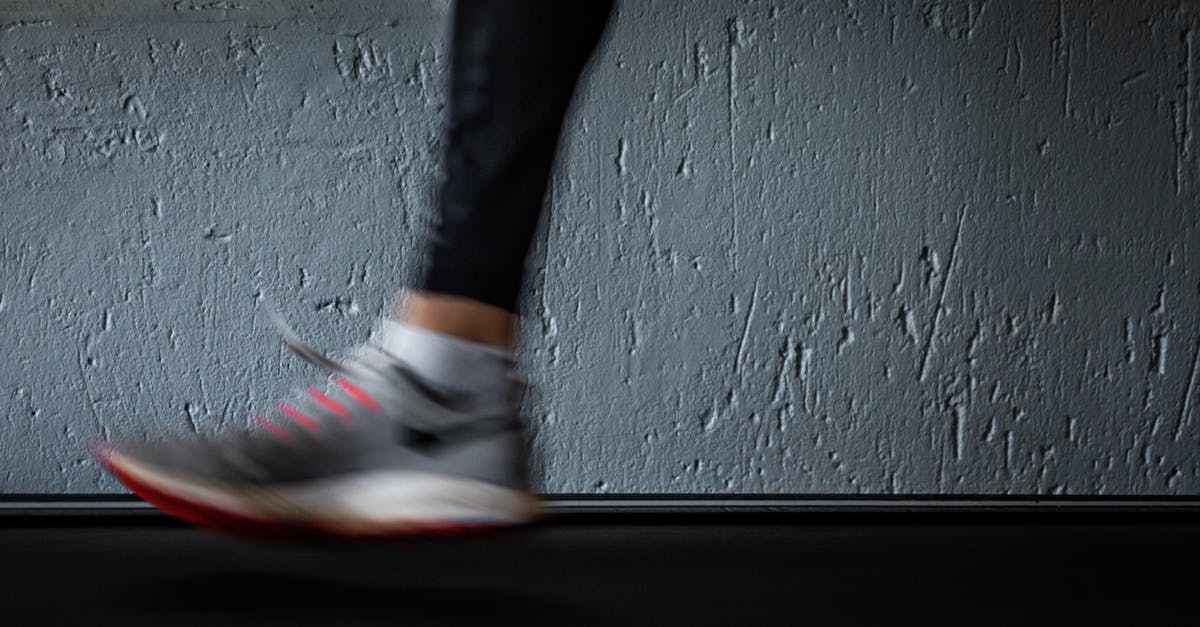 Is running speed an illusion? - Person in Black Pants Wearing White and Red Nike Sneakers