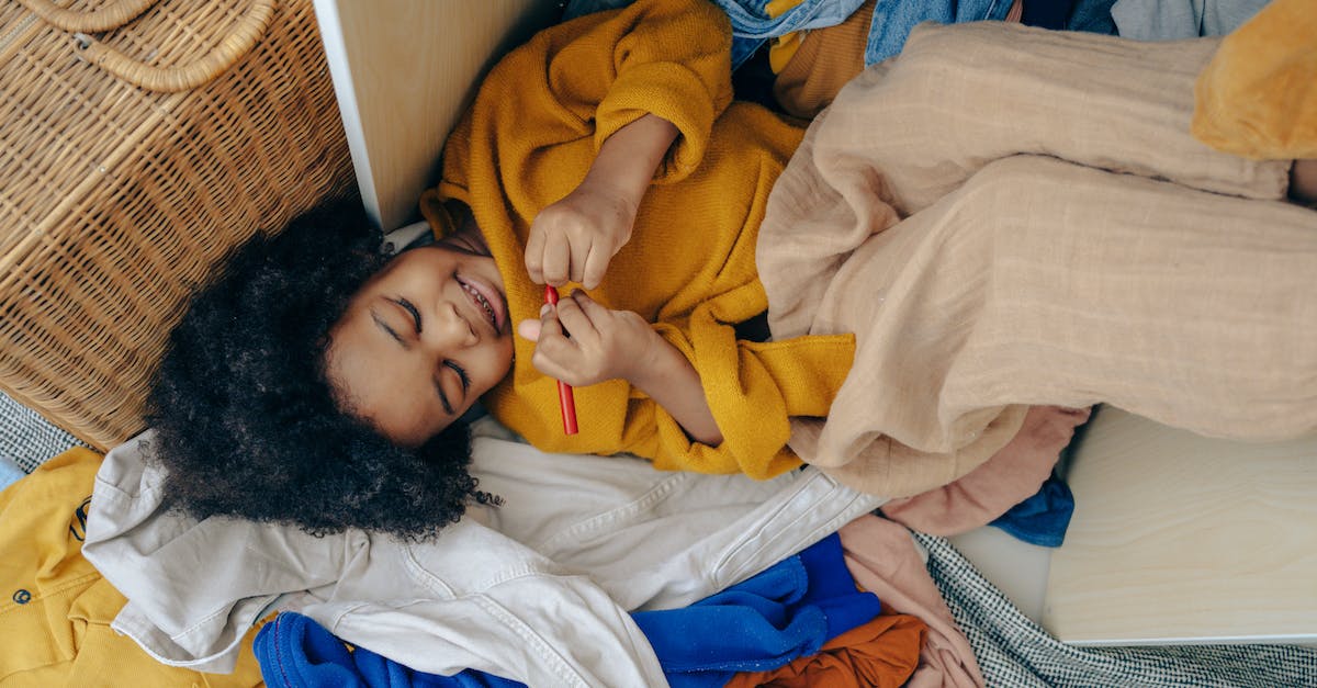 Is Sly Trilogy compatible with Cross-Buy? - Top view of funny cute little African American girl lying on pile of scattered clothes and drawing on hand with marker Is Sly Trilogy compatible with Cross-Buy? - Top view of funny cute little African American girl lying on pile of scattered clothes and drawing on hand with marker