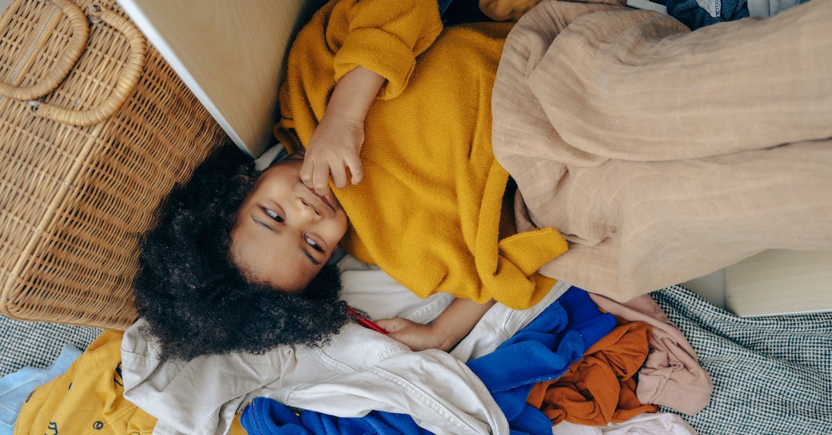 Is Sly Trilogy compatible with Cross-Buy? - Cute little African American child lying on stack of clothes Is Sly Trilogy compatible with Cross-Buy? - Cute little African American child lying on stack of clothes