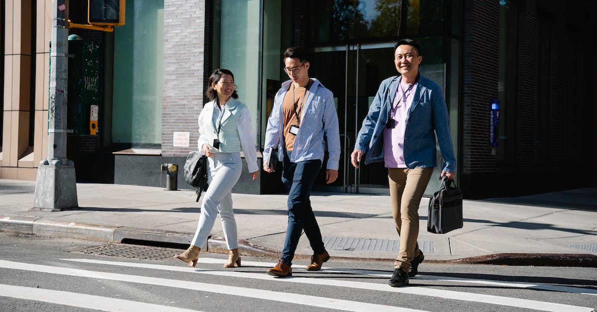 Is Sly Trilogy compatible with Cross-Buy? - 3 Men and 2 Women Standing on Sidewalk Is Sly Trilogy compatible with Cross-Buy? - 3 Men and 2 Women Standing on Sidewalk