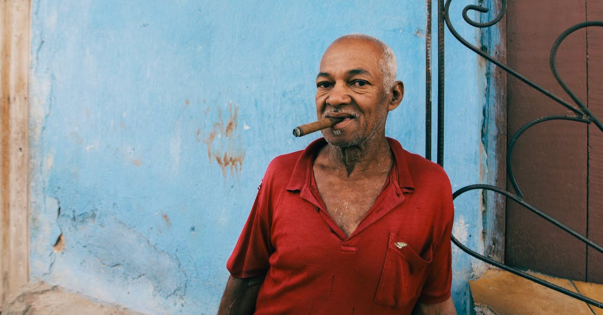 Is smoking battleships worthless? - Man in Red Polo Shirt Smoking Cigarette Is smoking battleships worthless? - Man in Red Polo Shirt Smoking Cigarette