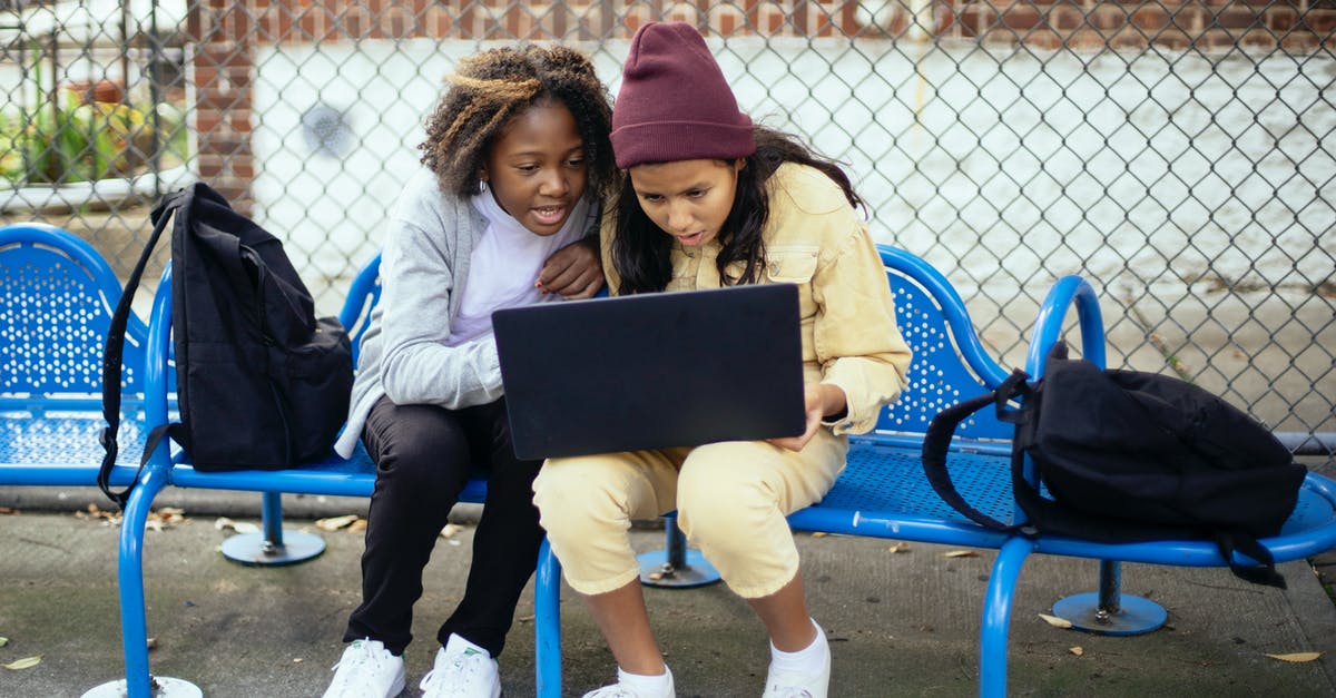 Is Super Mario Run's full version shared between device accounts? - Surprised multiethnic schoolchildren watching laptop on urban bench Is Super Mario Run's full version shared between device accounts? - Surprised multiethnic schoolchildren watching laptop on urban bench