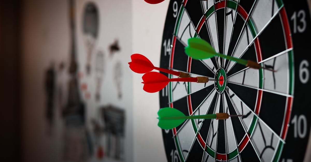 Is the darts minigame in the Final Fantasy VII Remake based on a real variant of darts? - Close-Up Photo of Dart Pins on Dartboard