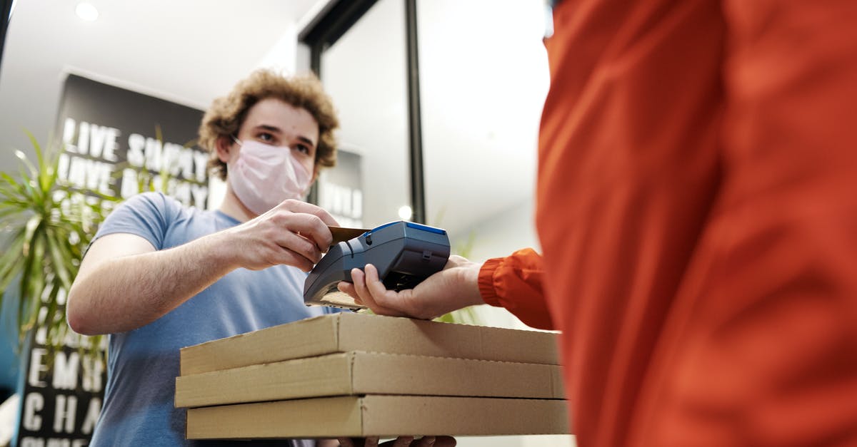 Is the DotA Mod receiving the same patches as DotA 2? - Man Wearing a Face Mask Paying for Pizza Delivery