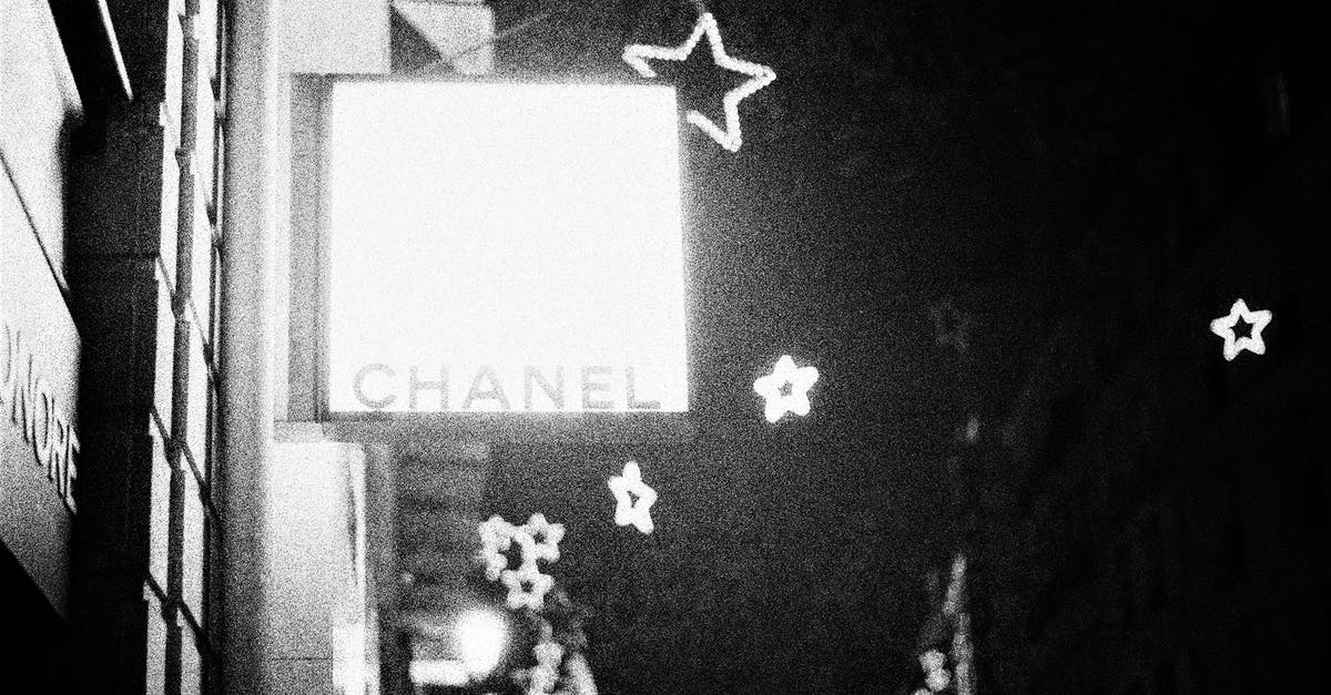 Is the guaranteed four star always the last hero drawn? - Grayscale Photo of Man and Woman Sitting on Chair