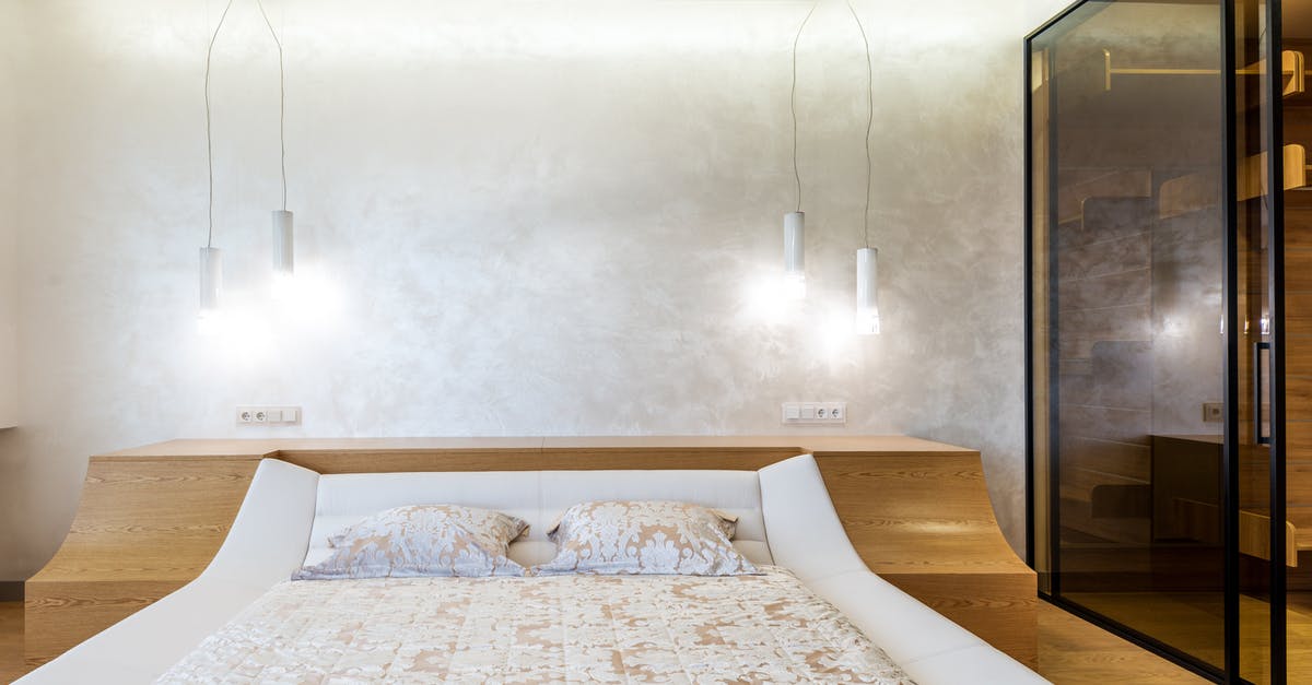 Is the new Feast mastery more impactful than Double Edged Sword? - Stylish interior design of spacious bedroom lighted with set of lamps furnished with bed and wardrobe closet with glass doors