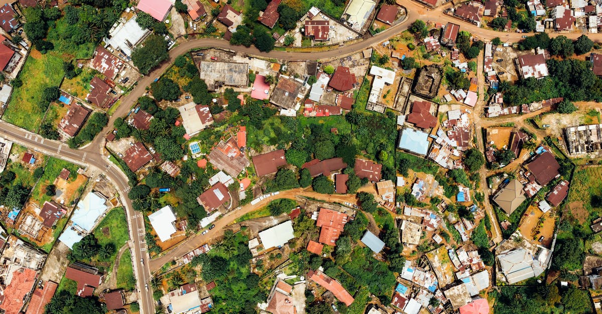 Is the quote 'Meet me behind [name of guide]'s house in three hours.' From the traveling merchant true? - Aerial Photo of House Roofs Of A Residential Area