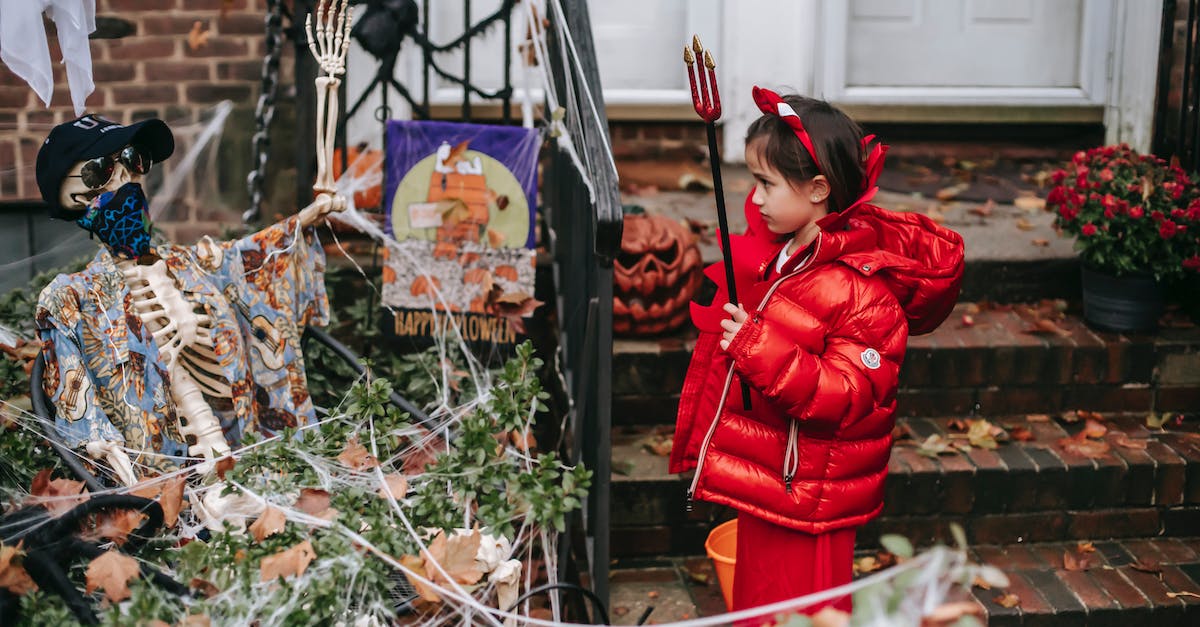 Is the selected Clan War Base unusable if it as the little red house icon? - Little girl in devil costume on Halloween near house