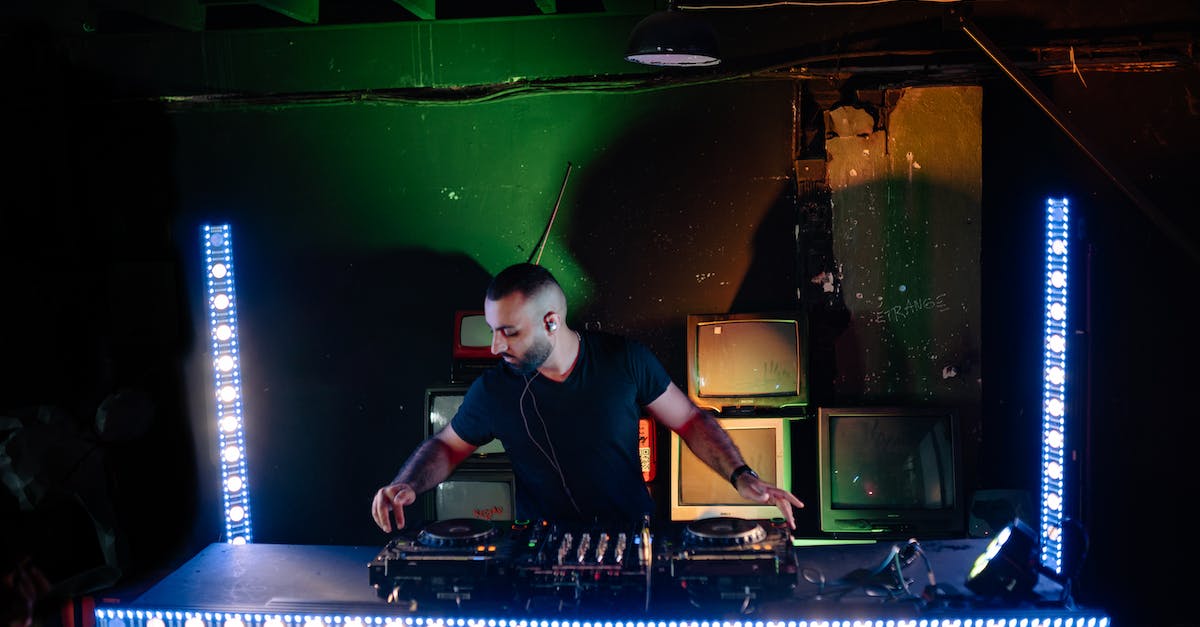 Is the XCOM Enemy Within Commander Edition DLC on the disc? - A Man in Black Shirt Using an Audio Mixer