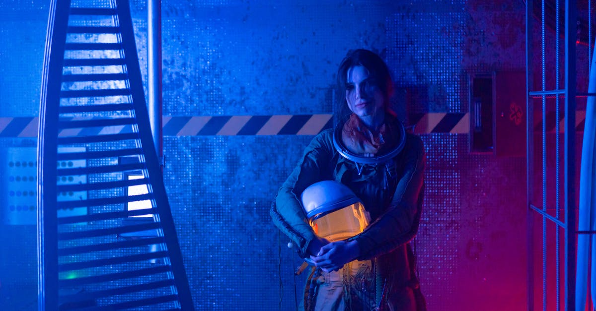 Is there a better way of finding emeralds? - Woman in Red and Black Dress Holding Black Leather Handbag