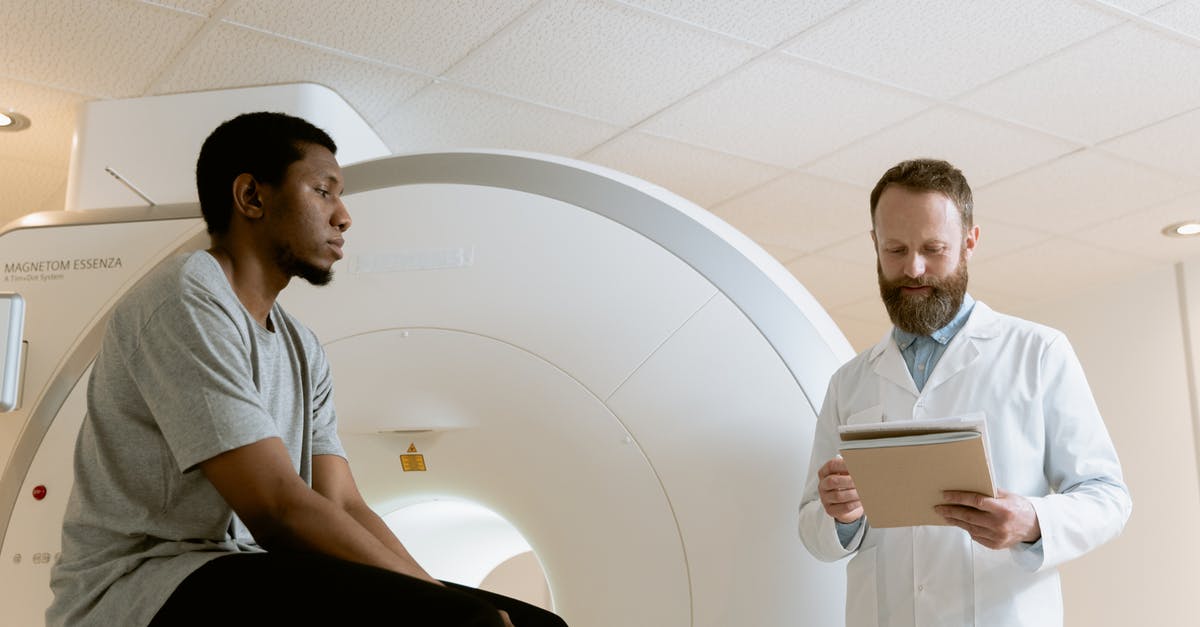 Is there a bonus for scanning an entire planet? - Photo Of Medical Practitioner Looking Through Patient's Records