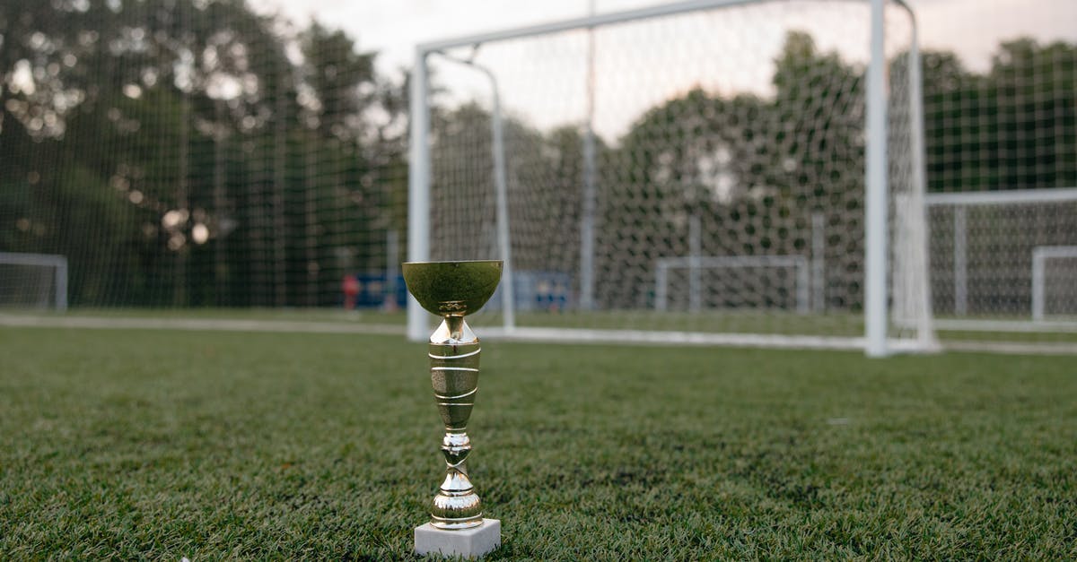 Is there a champion that can outrange turrets without Firecannon? - Gold Trophy on Green Grass Field