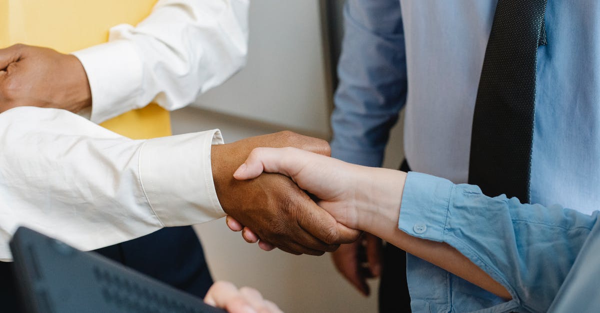 Is there a contract expiry column on the team squad page? - Crop anonymous diverse entrepreneurs shaking hands after meeting and negotiating about new project