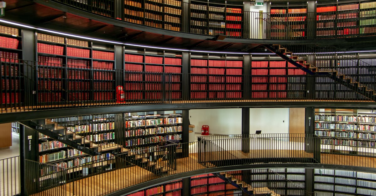Is there a difference between a staircase made by a monster and a staircase found under a rock? - Interior of library with bookshelves