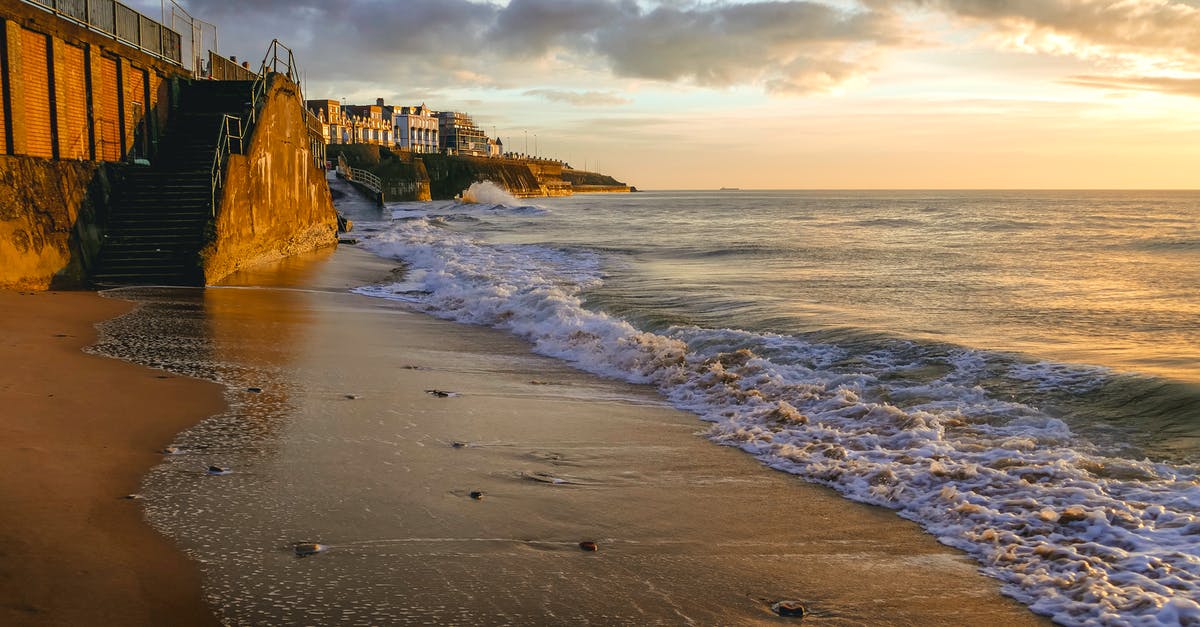 Is there a difference between a staircase made by a monster and a staircase found under a rock? - White High Rise City Buildings Near Seashore