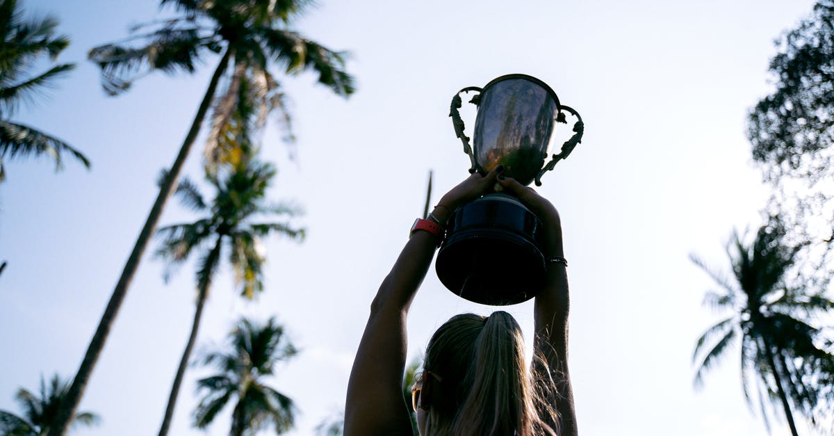 Is there a disadvantage to being higher level in low trophy arenas? - A Woman Holding a Trophy