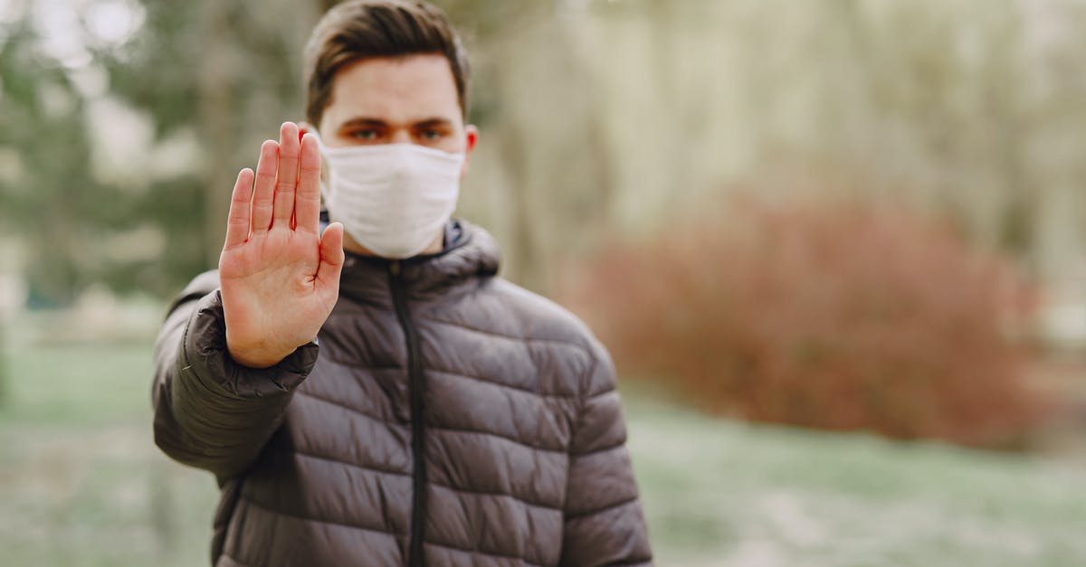Is there a Doctor anywhere on Point Lookout? - Man in medical mask showing stop sign Is there a Doctor anywhere on Point Lookout? - Man in medical mask showing stop sign