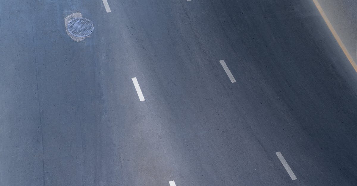 Is there a faster way to hatch eggs? - From above abstract background of empty asphalt road with manhole and symmetric white lines