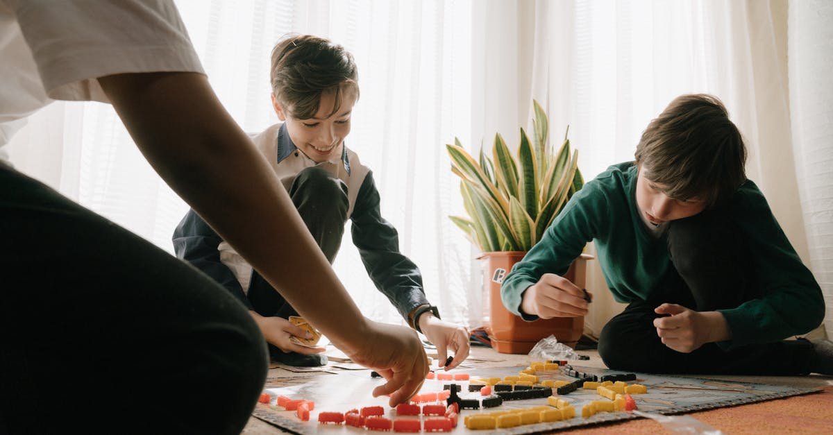 Is there a key for the map icons in game? - Man in Green Long Sleeve Shirt Playing Chess