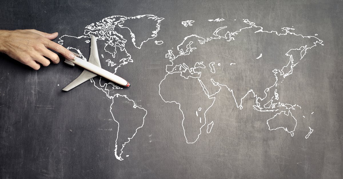 Is there a known way to map all possible analog stick values to buttons? - From above of crop anonymous person driving toy airplane on empty world map drawn on blackboard representing travel concept