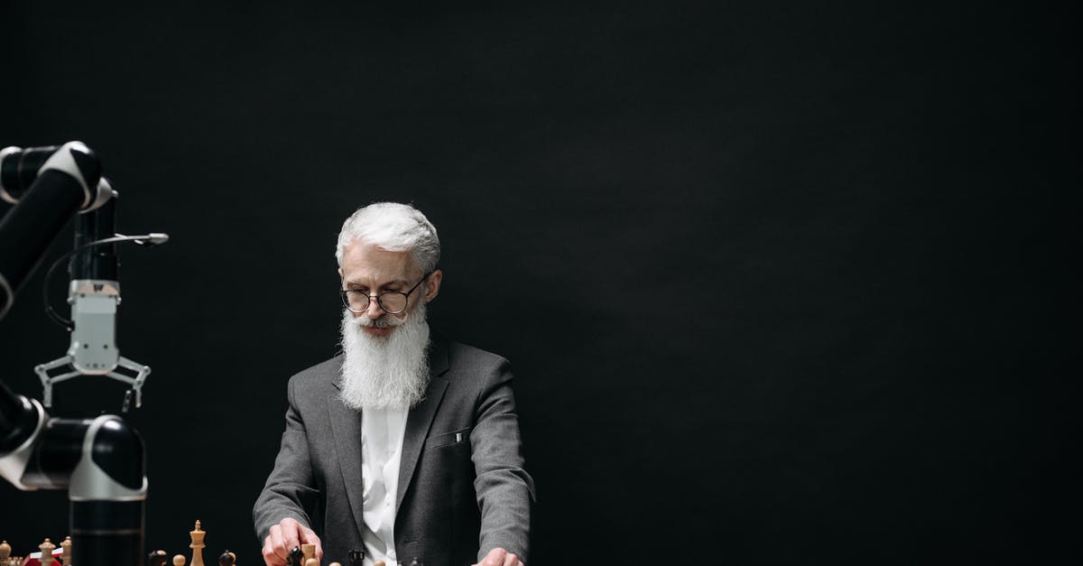 Is there a limit of robots the game can handle? - Man in Black Suit Jacket Playing Chess