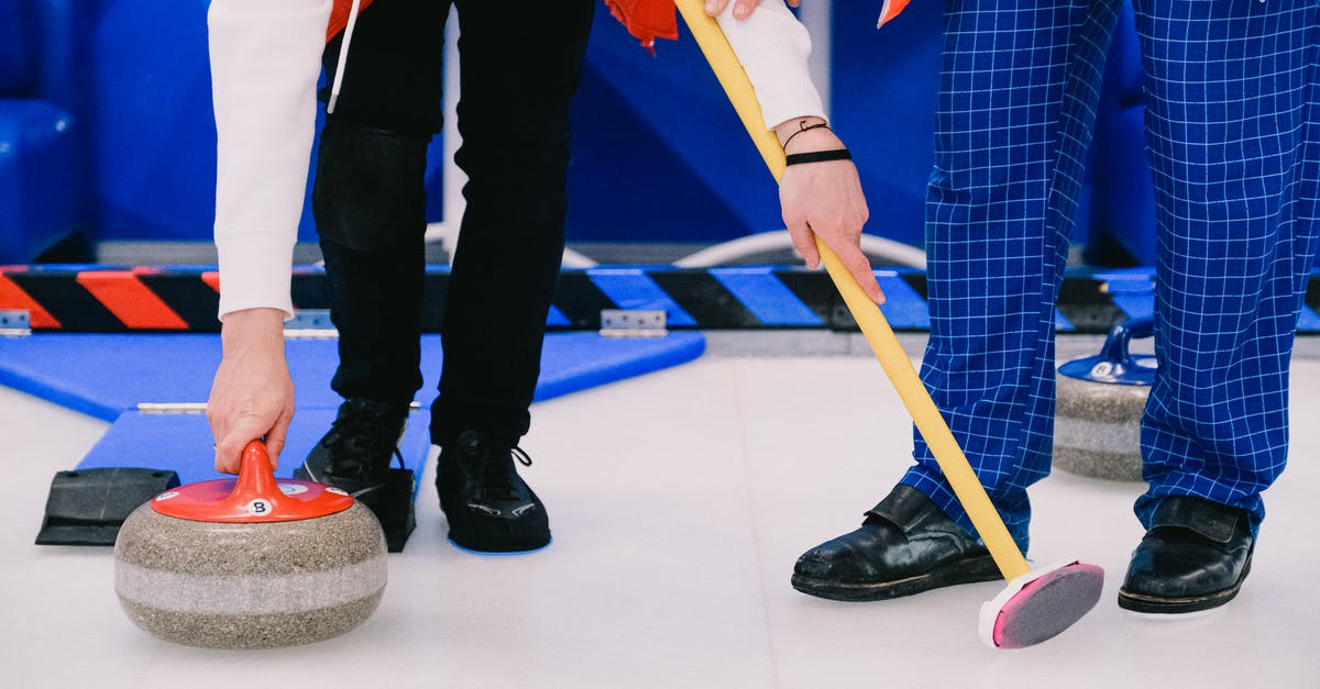 Is there a limit of robots the game can handle? - Sportspeople standing with broom and curling stone