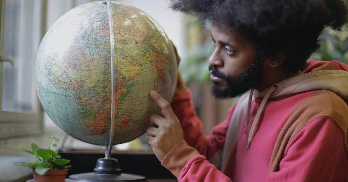 Is there a limit to the amount of "pieces" you can place in the map builder? - Thoughtful young bearded ethnic man with globe sitting at table in modern room Is there a limit to the amount of "pieces" you can place in the map builder? - Thoughtful young bearded ethnic man with globe sitting at table in modern room