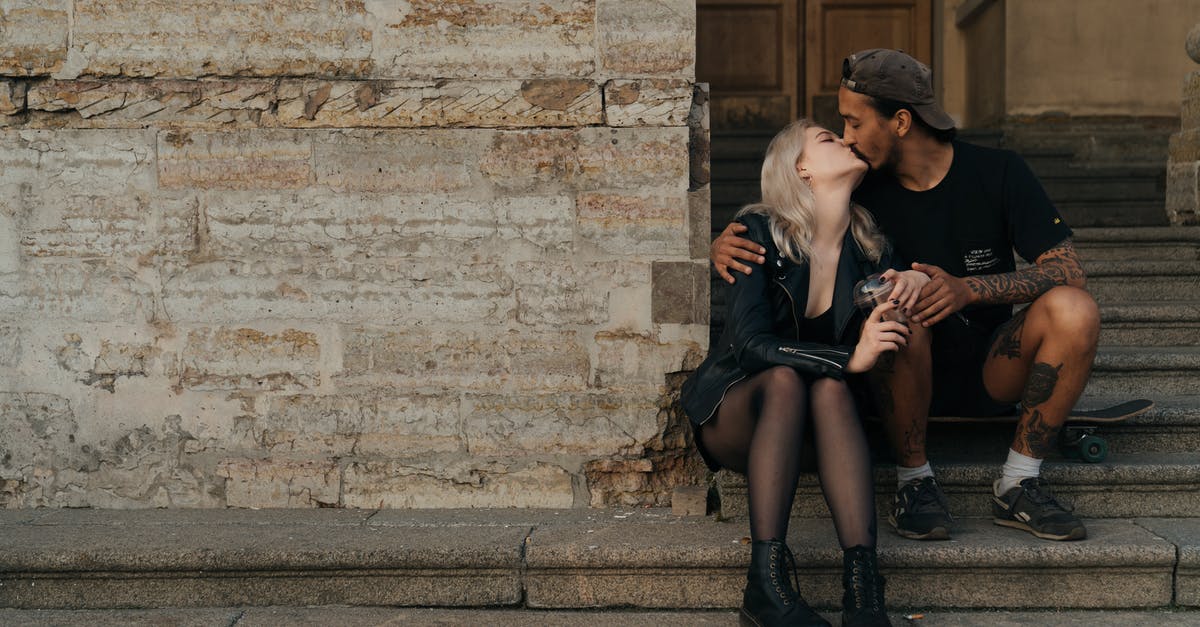 Is there a <10 relationship cap with bachelor/bachelorettes who aren't your spouse? - Couple Sitting on Concrete Stairs While Kissing