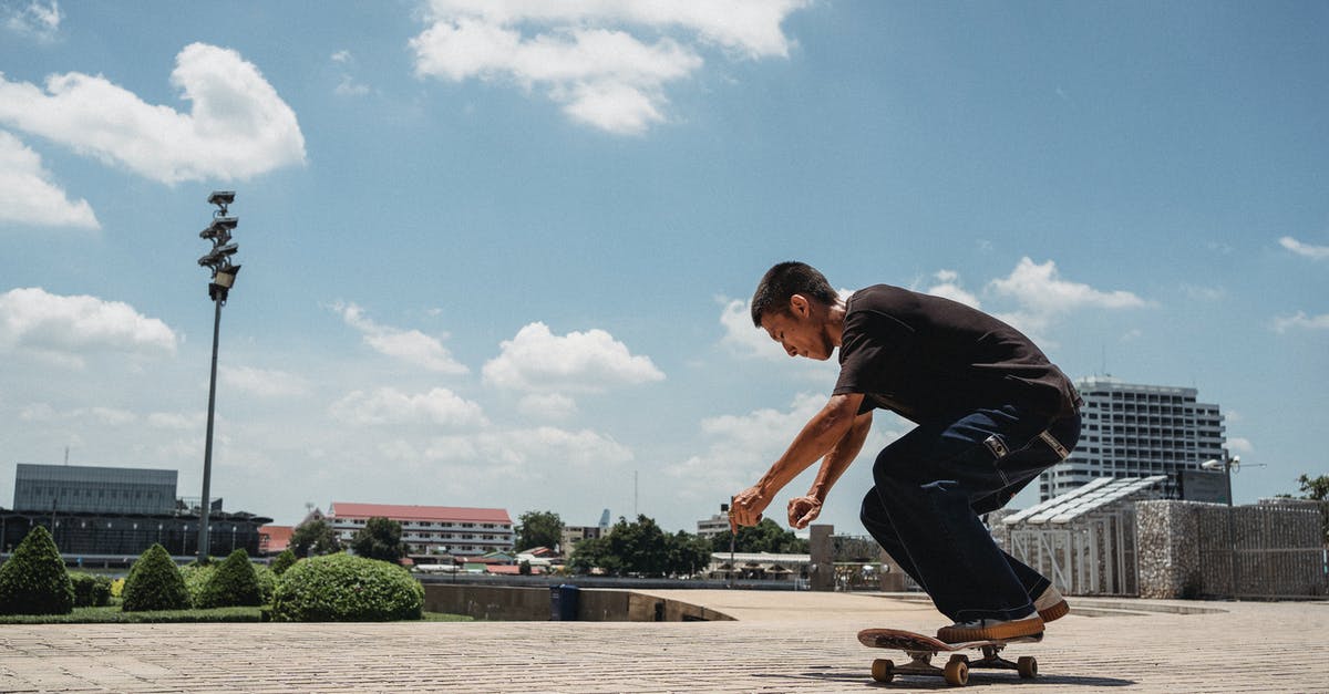 Is there a max skill level? - Side view of active male skater riding skateboard on sidewalk of modern city