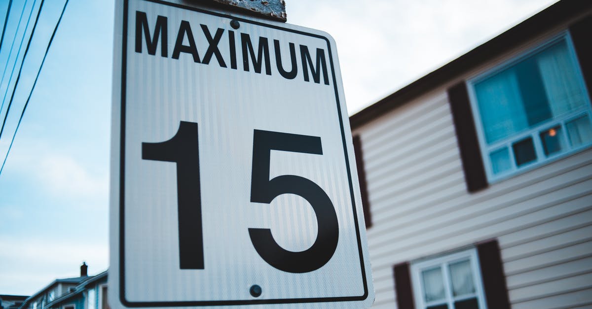 Is there a maximum number of tripwires I can set? - Regulatory road sign with Maximum inscription and number 15 against house facade in city in daytime