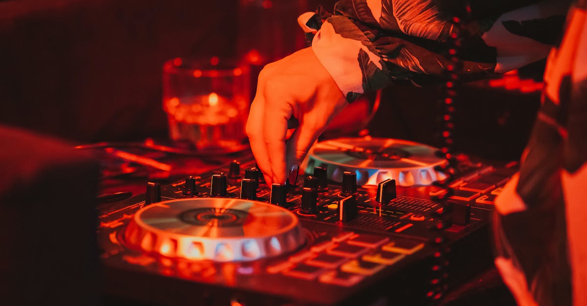 Is there a panel that shows me employment? - DJ mixing music on remote control in nightclub